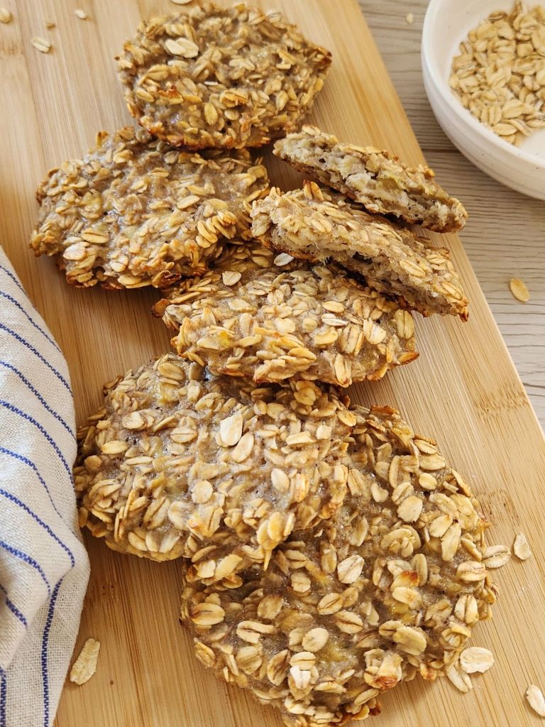 Healthy 2-ingredient banana oat cookies on a wooden board