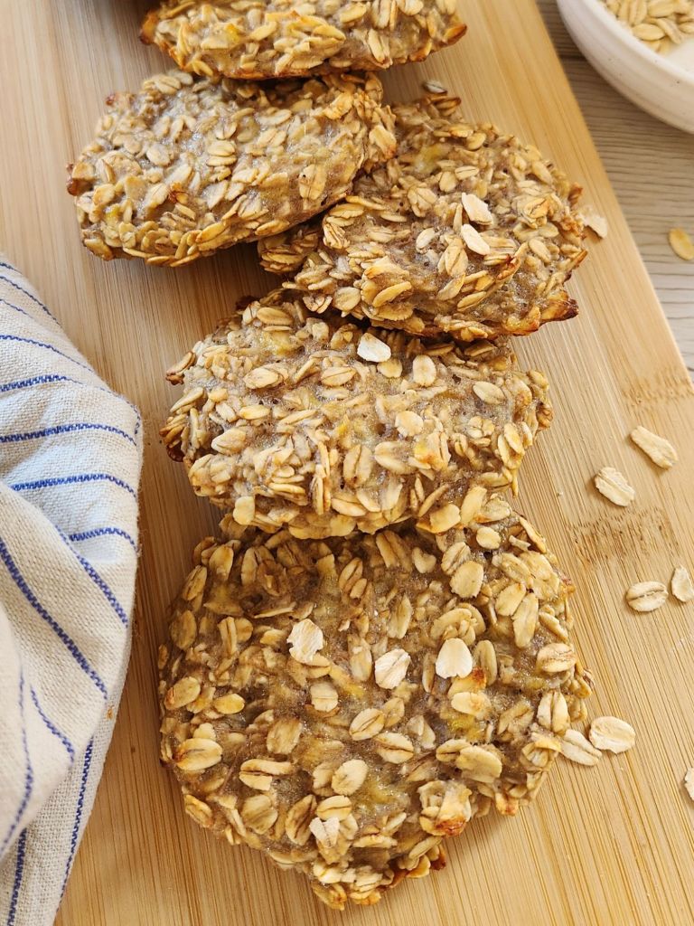 Healthy 2-ingredient banana oat cookies on a wooden board